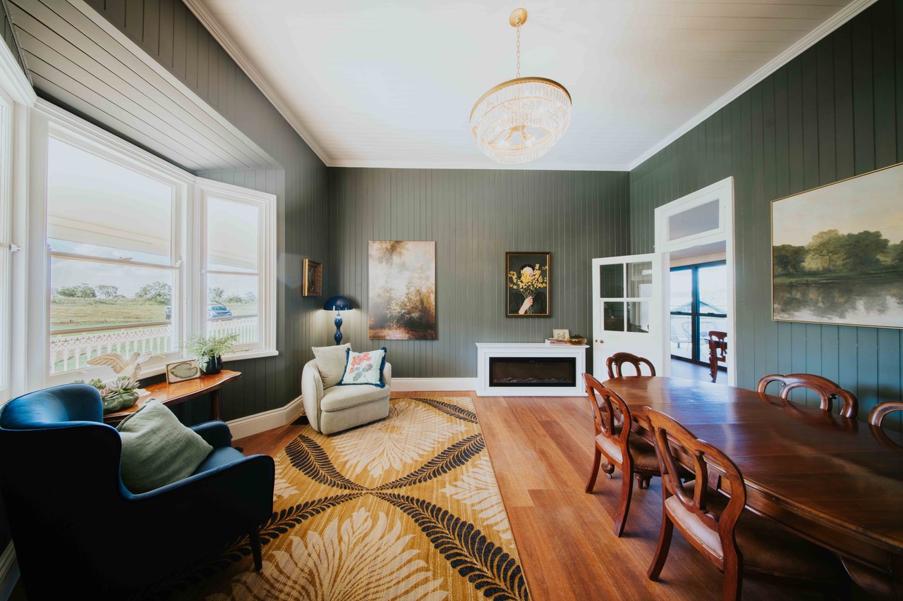 The living and dining room, styled with antiques and a hand-picked collection of artwork.