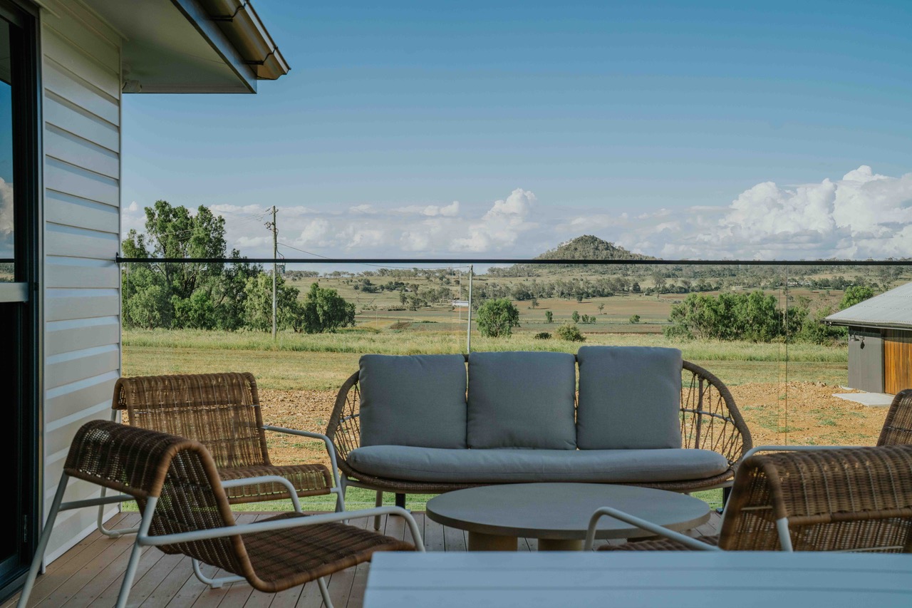 The verandah looks straight out over open Darling Downs farmland.