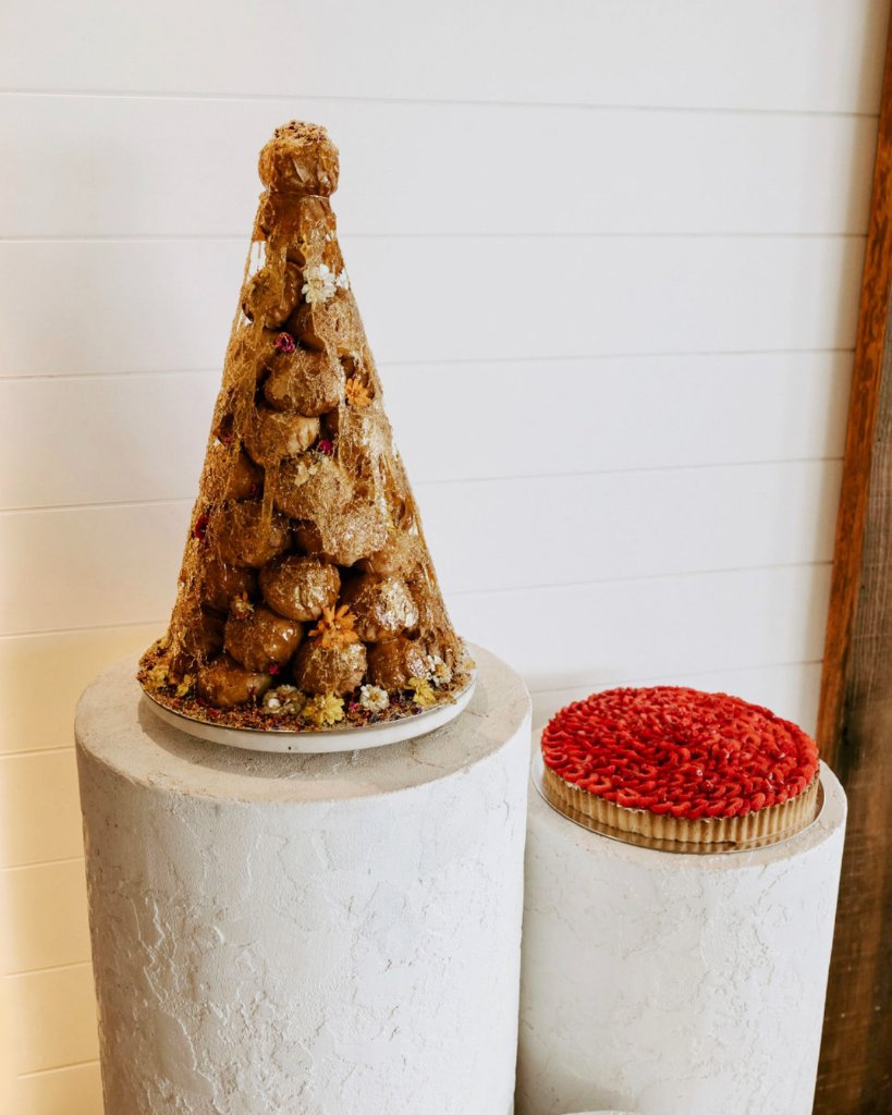 Croquembouche and raspberry tart on display at Eclair at the Bay
